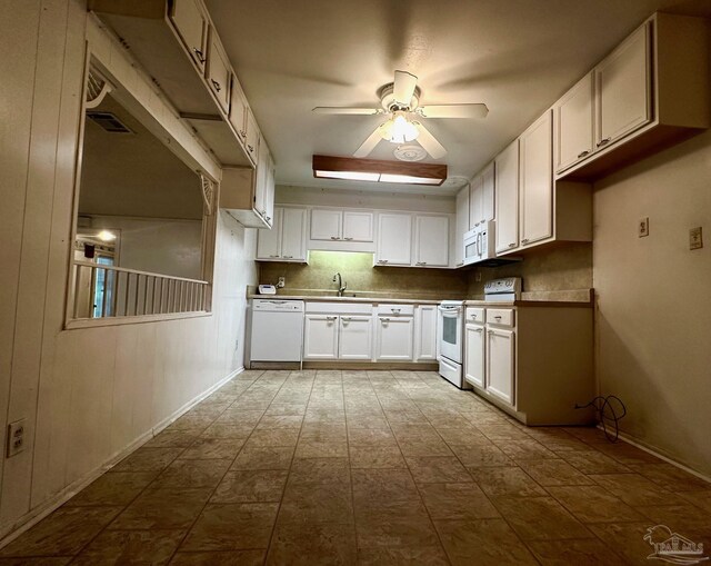 4681 Kingston Dr, Pensacola, FL 32526 - kitchen with white appliances, ceiling fan, and white cabinetry