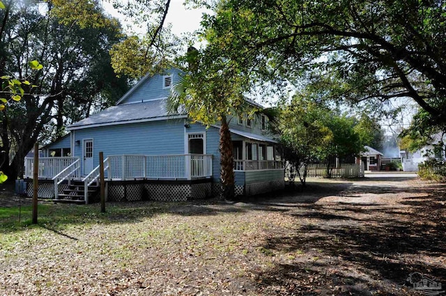 view of property exterior featuring a deck