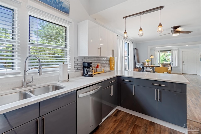 kitchen with dishwasher, decorative light fixtures, white cabinets, dark hardwood / wood-style flooring, and ceiling fan