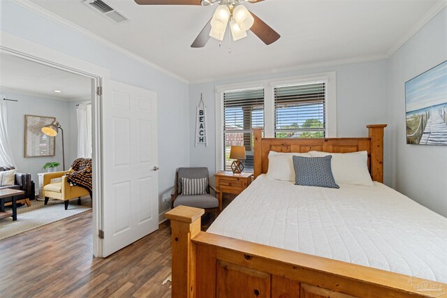 bedroom featuring ceiling fan, ornamental molding, and hardwood / wood-style flooring