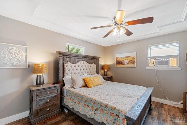 bedroom with ceiling fan, dark wood-type flooring, and cooling unit