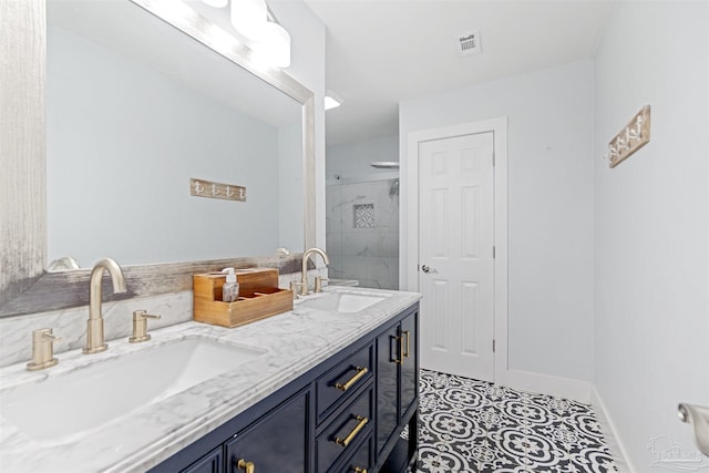 bathroom with tile patterned floors, an enclosed shower, and vanity