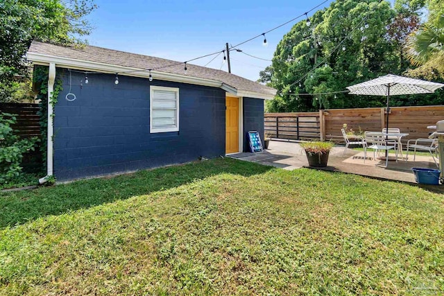 view of yard with a patio area and a fenced backyard