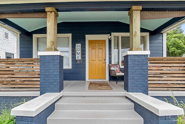 property entrance with covered porch