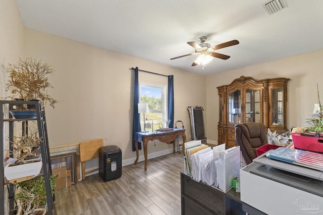 office space featuring wood-type flooring and ceiling fan