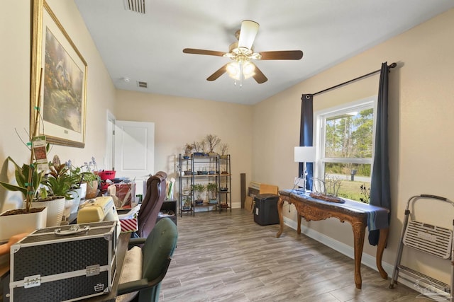 office area with ceiling fan and light hardwood / wood-style floors