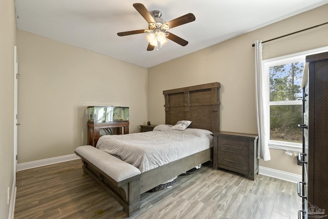 bedroom featuring ceiling fan and light hardwood / wood-style flooring