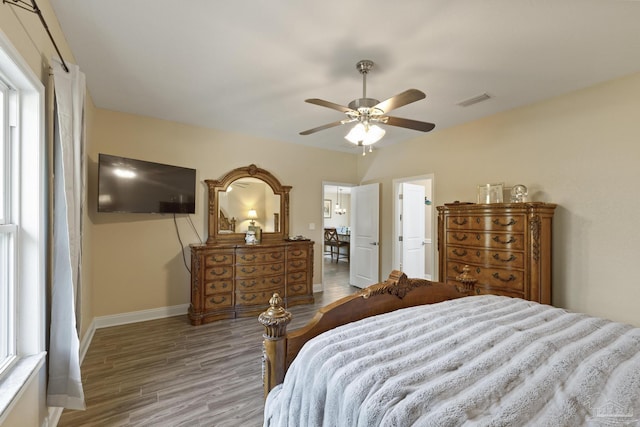 bedroom with hardwood / wood-style flooring and ceiling fan