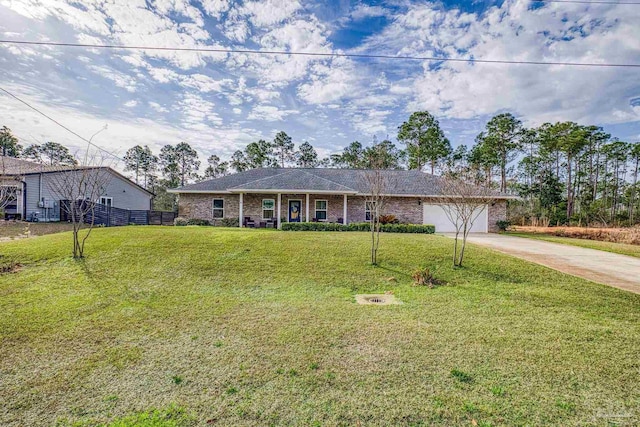 single story home with a garage and a front lawn