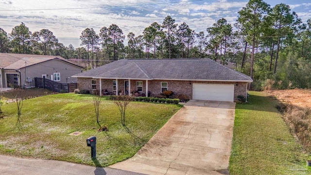 single story home with a garage, covered porch, and a front lawn