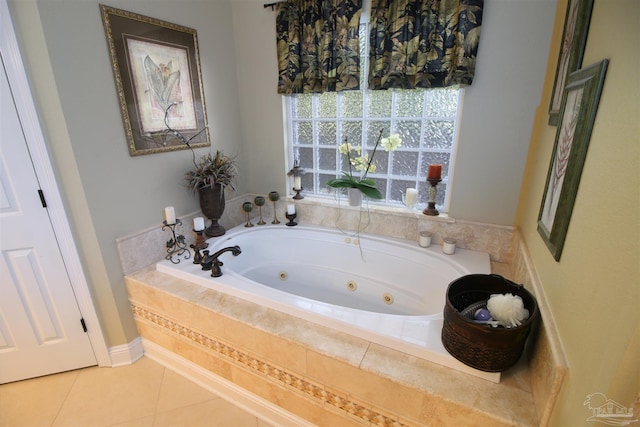 bathroom featuring a whirlpool tub and tile patterned floors