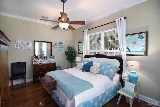 bedroom with baseboards, ceiling fan, wood finished floors, and visible vents