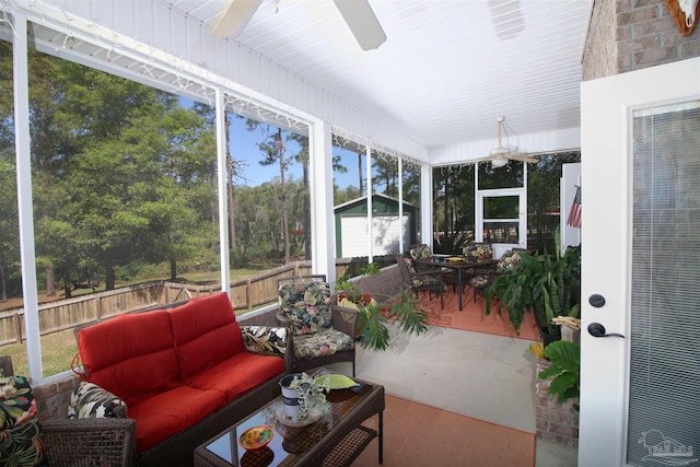 sunroom featuring an outdoor hangout area, a ceiling fan, and outdoor dining area