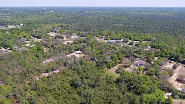 drone / aerial view with a view of trees