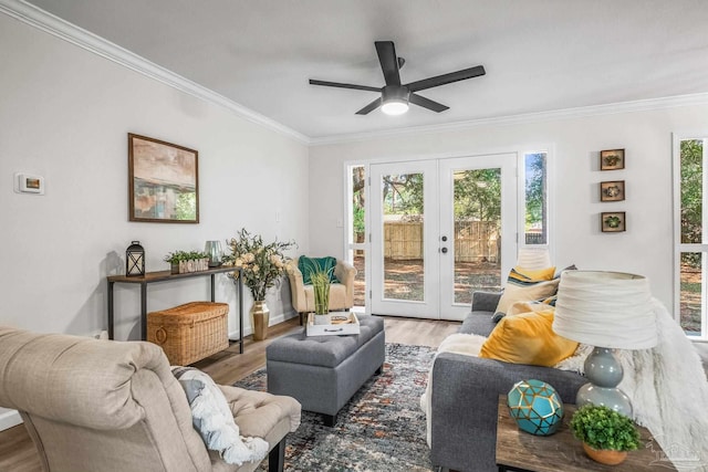 living room featuring ceiling fan, french doors, hardwood / wood-style floors, and ornamental molding