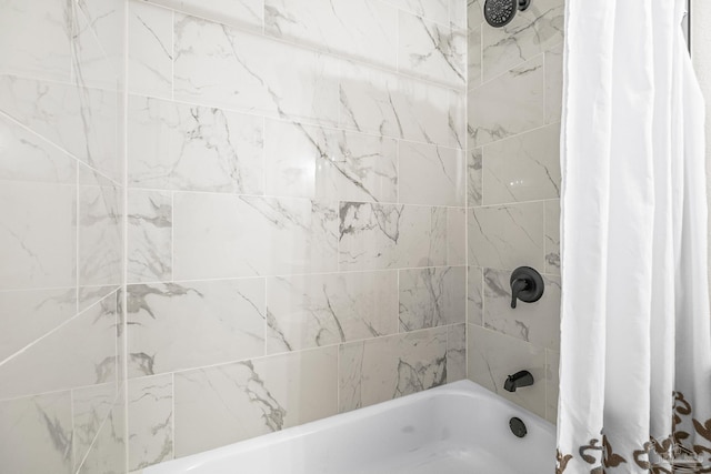 bathroom featuring shower / bathtub combination with curtain