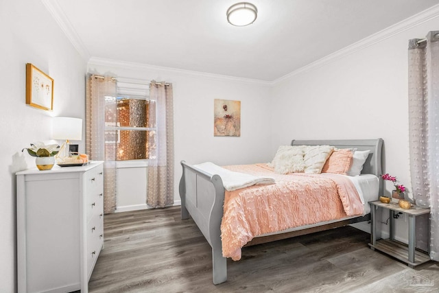 bedroom featuring hardwood / wood-style flooring and crown molding