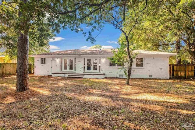 rear view of property featuring french doors