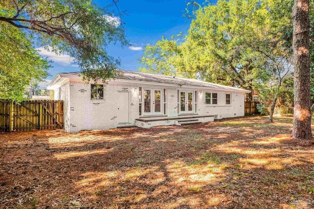 back of property featuring french doors