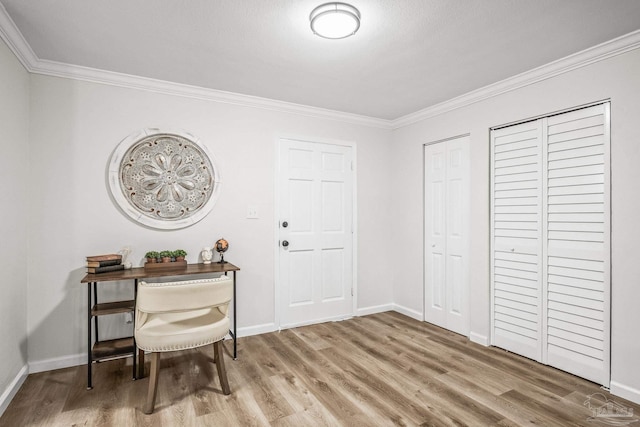 home office featuring hardwood / wood-style flooring and ornamental molding