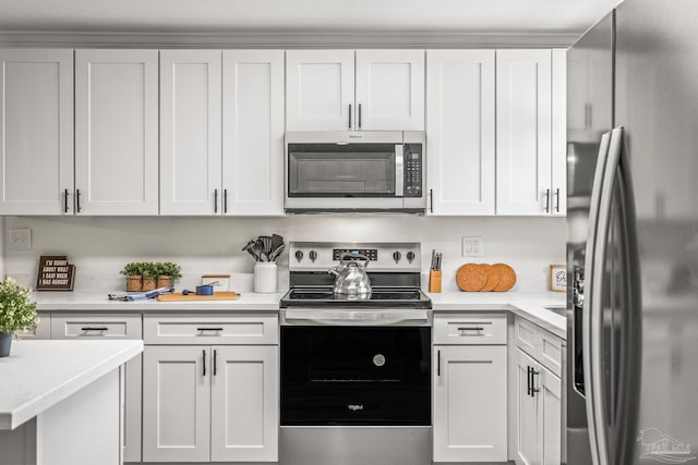 kitchen featuring white cabinets and stainless steel appliances