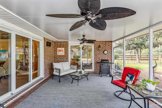 sunroom / solarium with ceiling fan