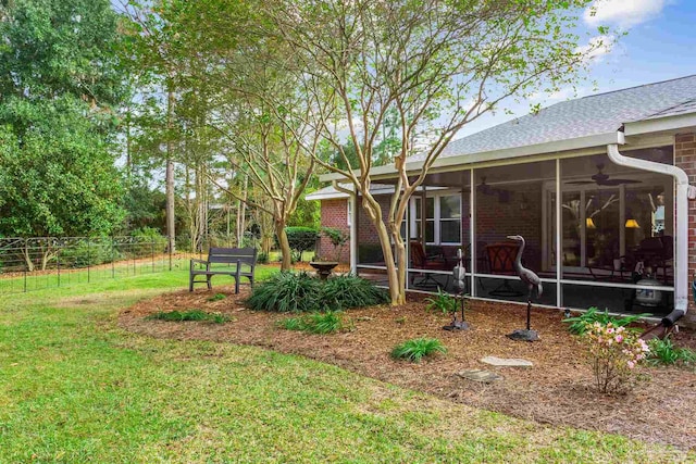 view of yard with a sunroom