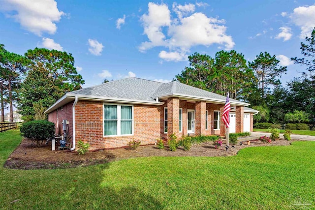 view of front of home with a garage and a front yard