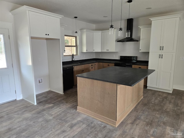 kitchen with black appliances, wall chimney range hood, dark countertops, and a sink