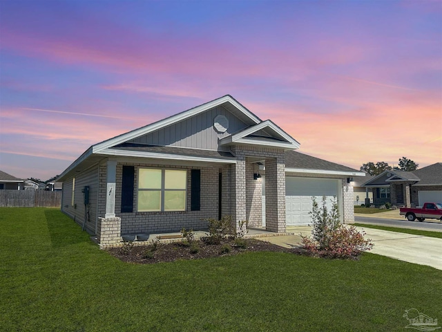 ranch-style house with driveway, fence, an attached garage, a front yard, and brick siding