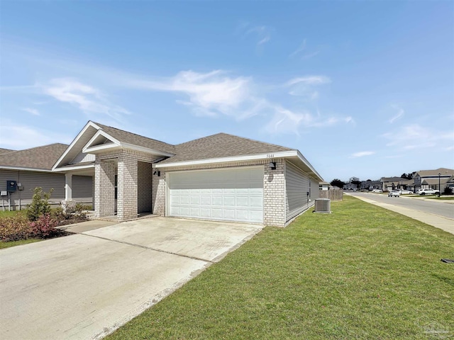 view of front of house featuring brick siding, an attached garage, concrete driveway, and a front lawn