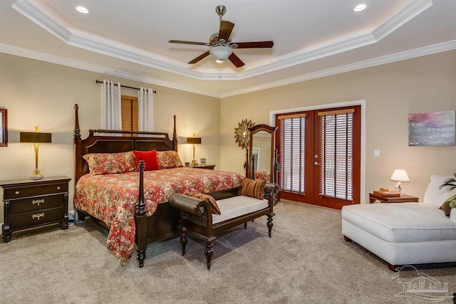 bedroom featuring ceiling fan, crown molding, and a tray ceiling