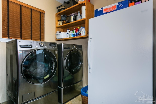 clothes washing area with independent washer and dryer