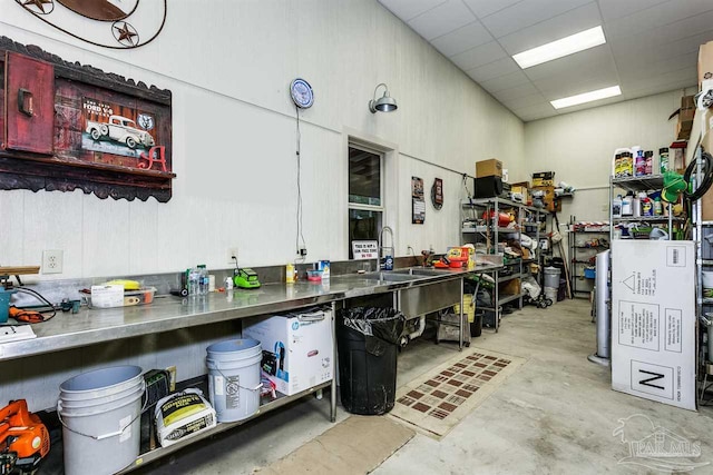 kitchen featuring sink and a drop ceiling