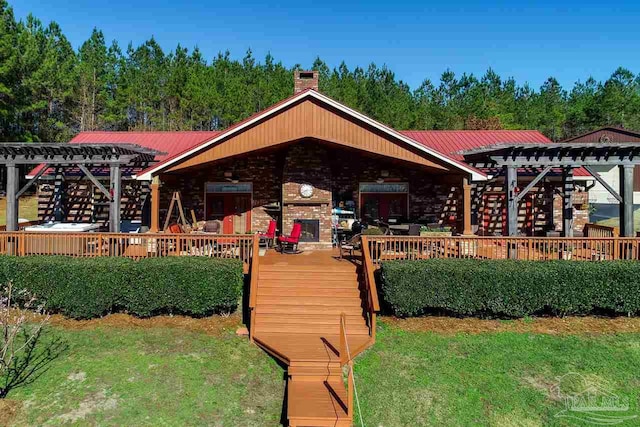 exterior space featuring a deck, a pergola, and a yard