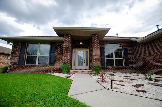 4777 Belvedere Cir, Pace, FL 32571 - doorway to property with brick siding and a lawn