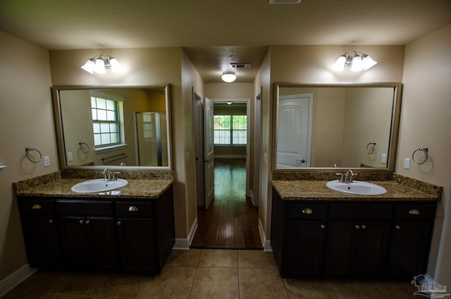 4777 Belvedere Cir, Pace, FL 32571 - full bathroom with baseboards, two vanities, and tile patterned flooring