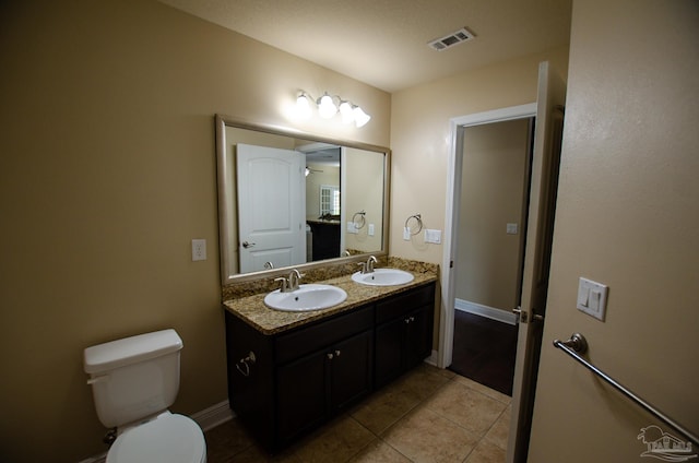 4777 Belvedere Cir, Pace, FL 32571 - bathroom featuring double vanity, tile patterned flooring, toilet, and baseboards