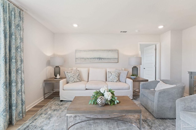 8748 Bluebell St, Milton, FL 32583 - living area featuring wood finished floors, baseboards, and recessed lighting