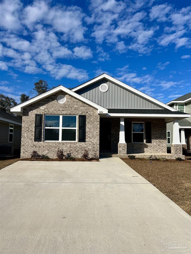 view of front of house with a porch and a front lawn