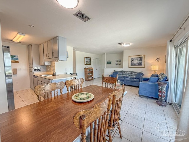 1448 Tina Dr Unit 213, Navarre Beach, FL 32566 - dining room featuring light tile patterned floors