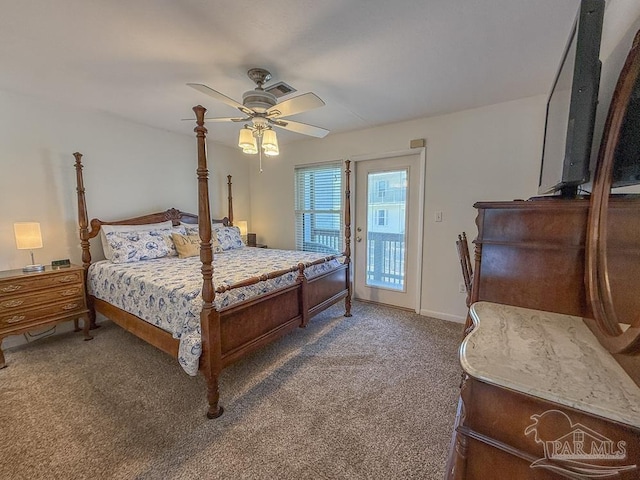1448 Tina Dr Unit 213, Navarre Beach, FL 32566 - carpeted bedroom featuring access to outside, ceiling fan, and baseboards