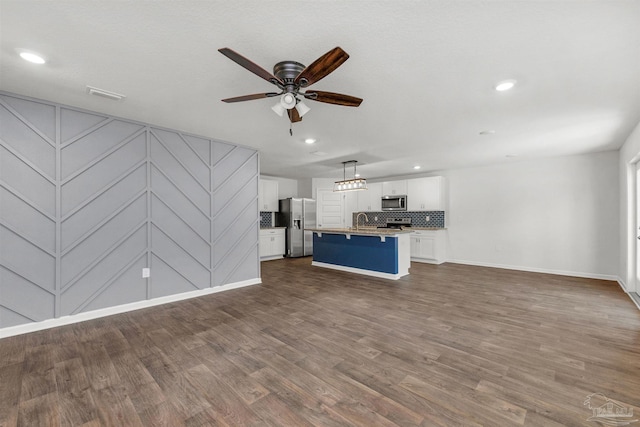 5457 Merlin Way, Milton, FL 32583 - unfurnished living room featuring ceiling fan, a sink, baseboards, dark wood finished floors, and recessed lighting