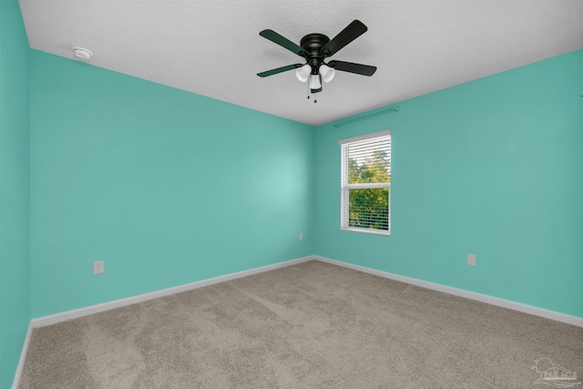 5457 Merlin Way, Milton, FL 32583 - spare room featuring baseboards, a smoke detector, carpet floors, and a ceiling fan