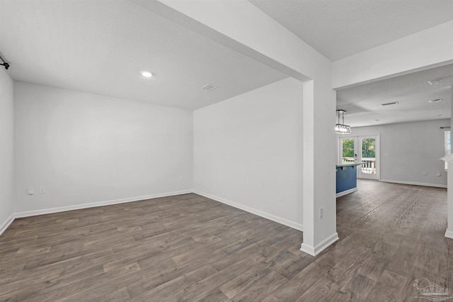 5457 Merlin Way, Milton, FL 32583 - spare room with wood finished floors, baseboards, and recessed lighting