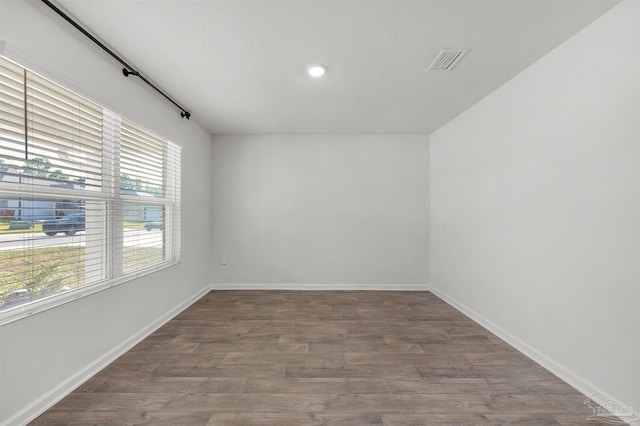 5457 Merlin Way, Milton, FL 32583 - spare room with wood finished floors, baseboards, and recessed lighting