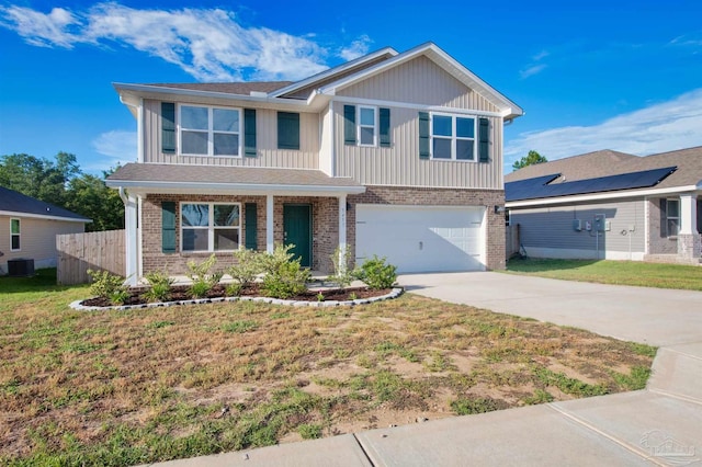 5457 Merlin Way, Milton, FL 32583 - view of front of house with brick siding, driveway, board and batten siding, a garage, and central air condition unit