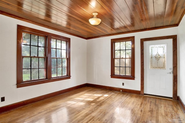 entryway featuring light wood-style flooring, a wealth of natural light, and baseboards