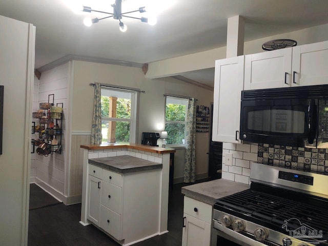 kitchen with white cabinets, backsplash, dark hardwood / wood-style flooring, and stainless steel range