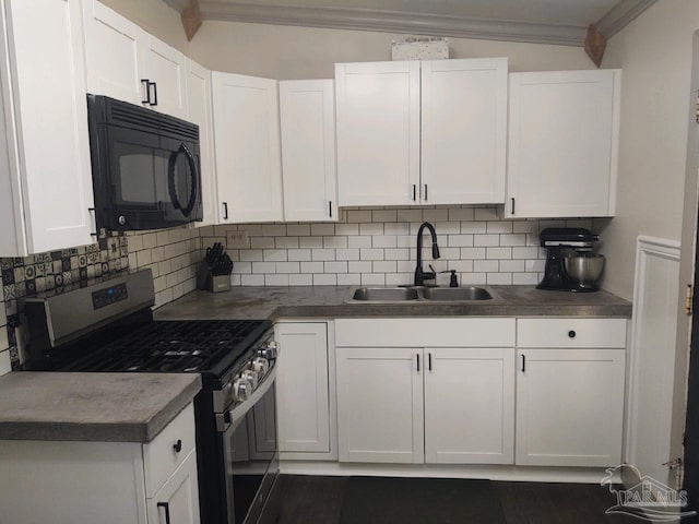 kitchen featuring white cabinetry, sink, tasteful backsplash, and stainless steel range oven